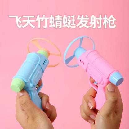PLASTIC TOY GUN WITH FLYING SAUCER